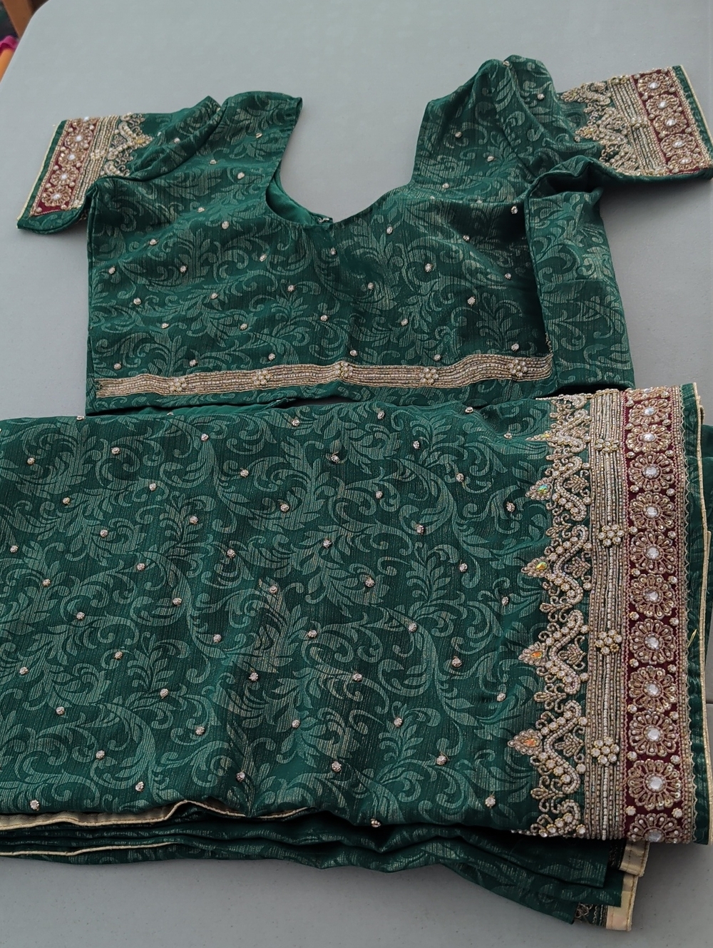 Elegant Green Embellished Women's Saree with Gold Accents